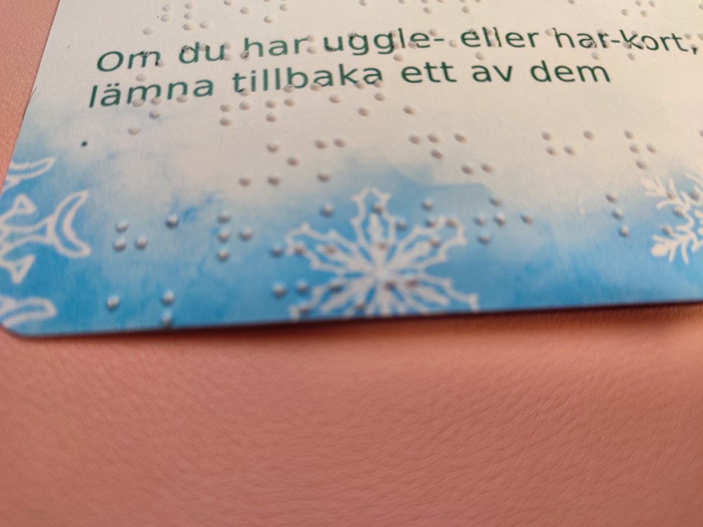 an event crad, where it is apparet the last braille line was cut short