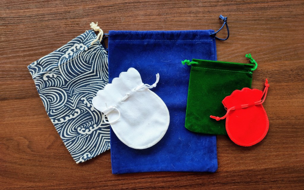 several cloth pouches: large, small, edium, round and rectangle shaped
