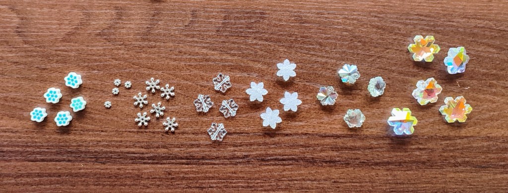 a lot of various shaped and sized snowflakes: metallic ones, acrylic ones, rubbery ones,...